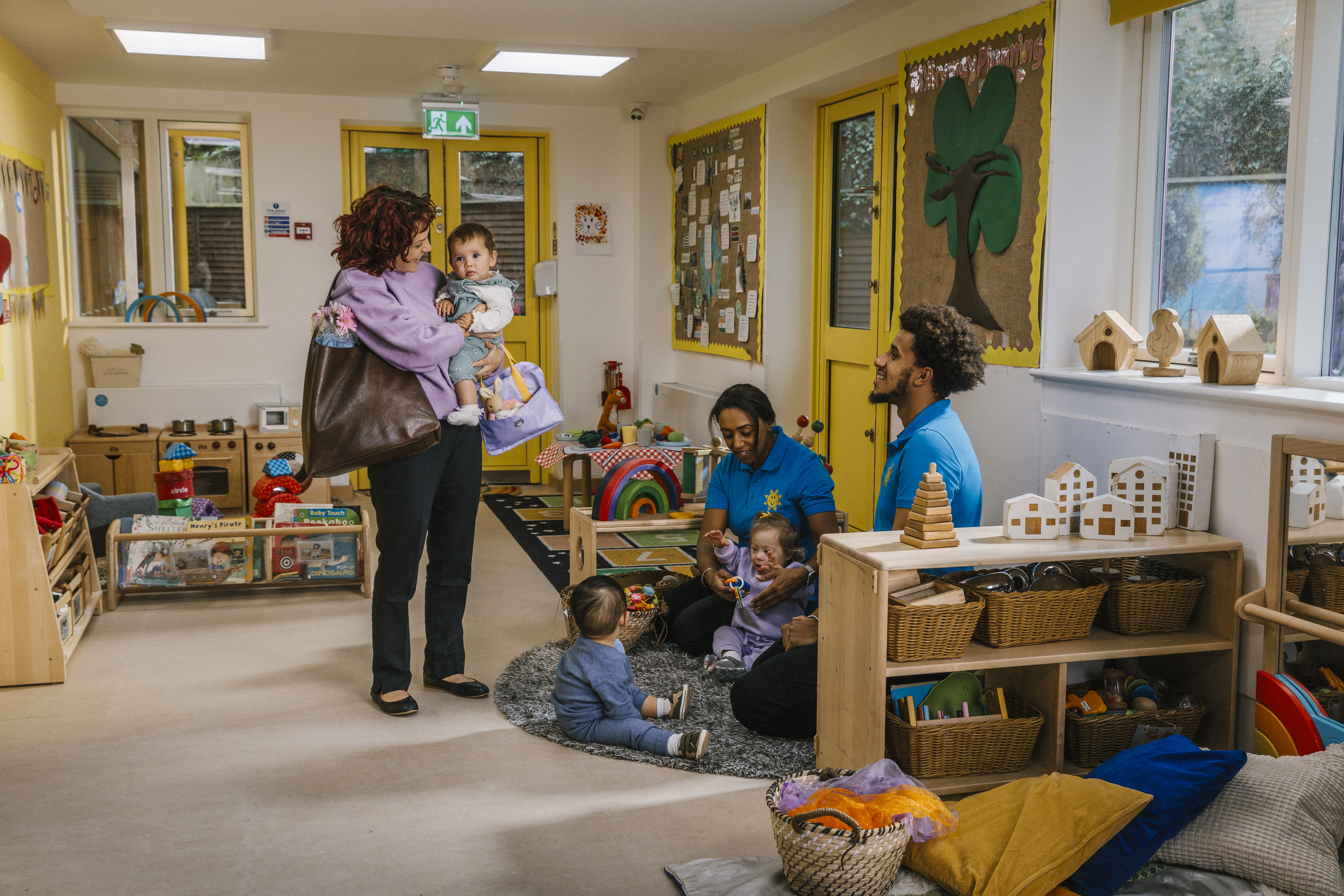 Parent picking up baby from childcare setting
